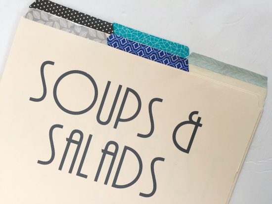 DIY page divider labeled "Soups & Salads" with washi tape on the tab. Will be used in DIY Recipe binder