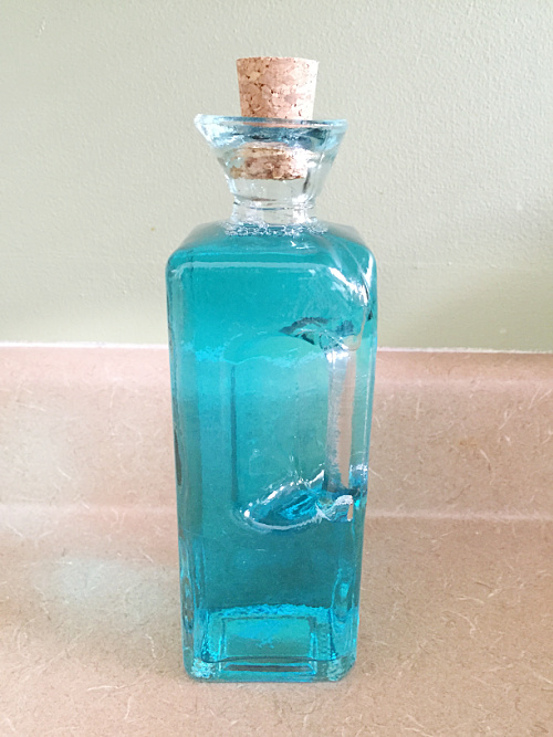 Jet Dry stored in glass bottle with cork top