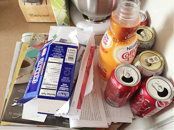 Pile of Recycle items sitting on kitchen counter