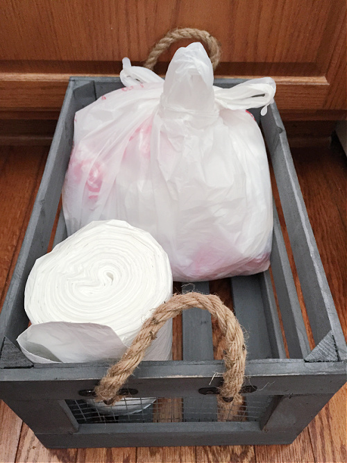 Wooden Crate Storing Trash Bags