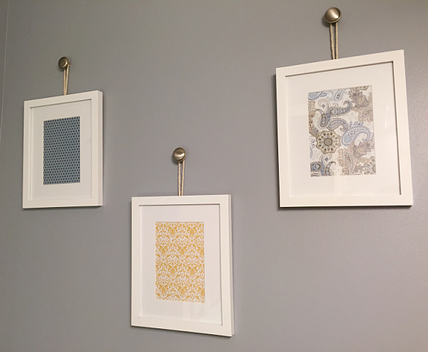 Frames hung from knobs using rope