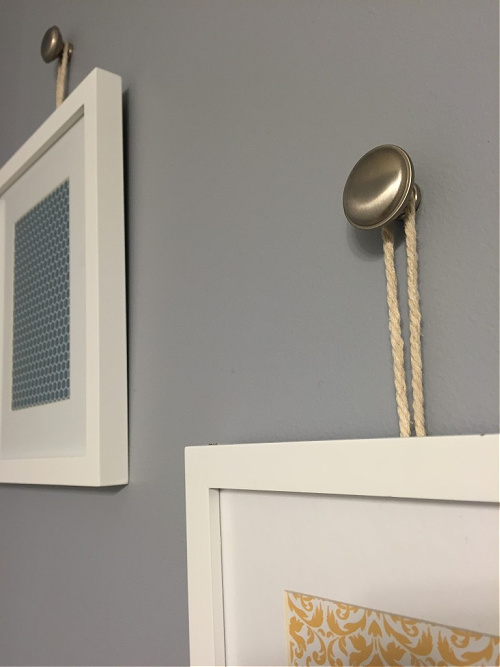 Two Frames Hanging from Knobs Using Rope