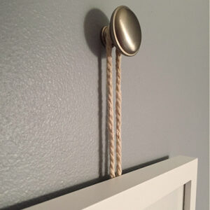 Picture Frame hung from a drawer knob with rope