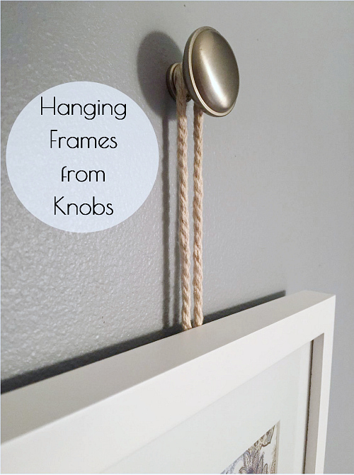 Such a cute idea to hang framed art or pictures from knobs.