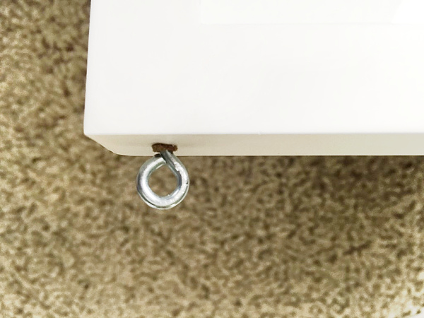 Screw eye in screwed into top of picture frame