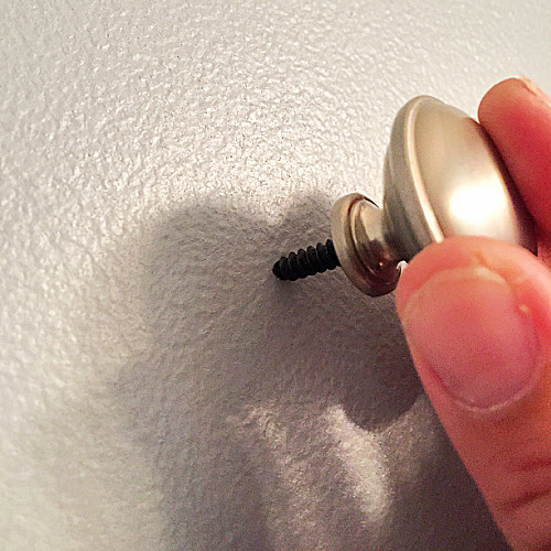 Screwing drawer knob into wall with a hanger bolt