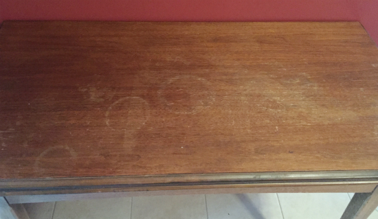 Old table top showing scratches and wear prior to using DIY Wood Polish