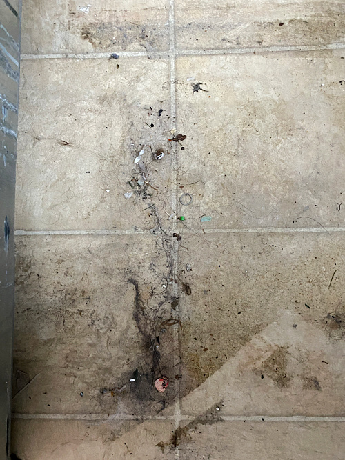 Linoleum floor under washing machine prior to cleaning with a DIY Floor Cleaner recipe
