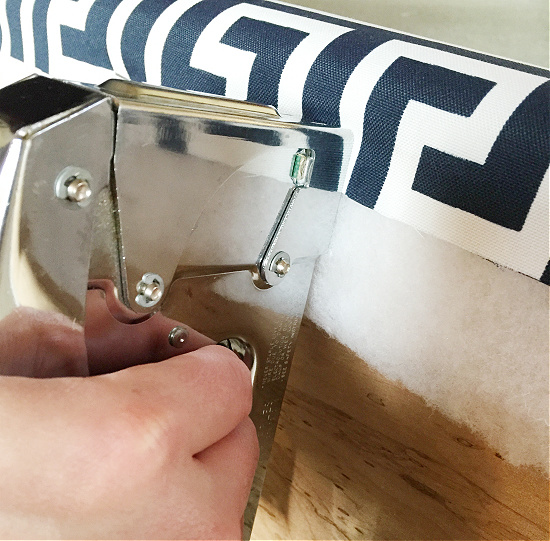 Stapling fabric to board to make a DIY Bench Cushion