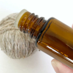 Adding essential oil to a dryer ball in order to scent drying laundry