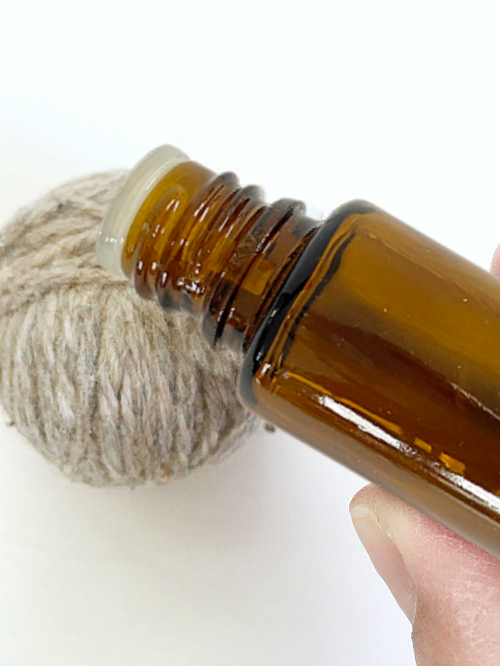 Adding essential oil to a dryer ball in order to scent drying laundry