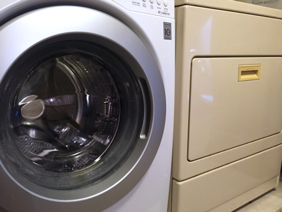 Mismatched appliances. White washing machine. Almond dryer.