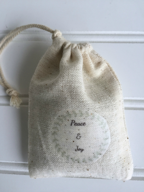 Tying off the drawstrings on a DIY Lavender Sachet