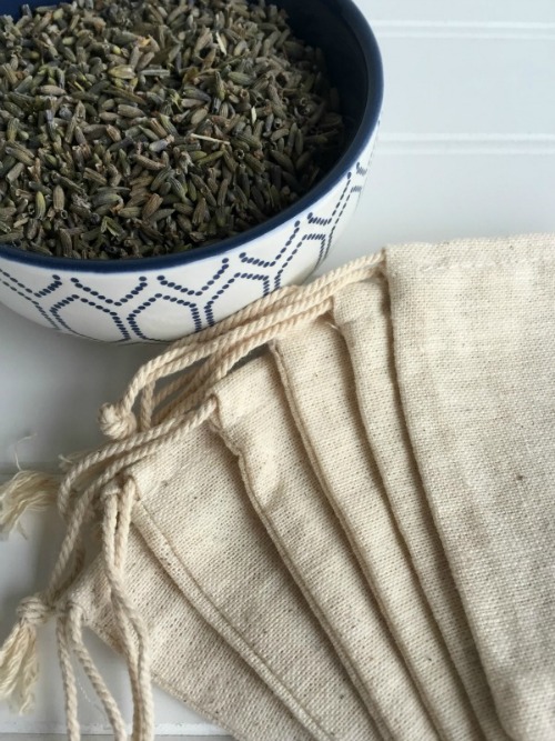 Items needed to make DIY Lavender Sachets: small muslin bags and dried lavender buds