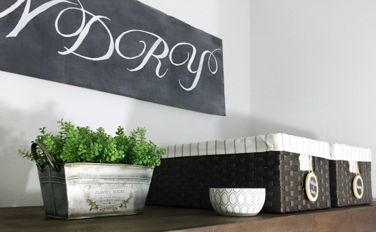 $85 Laundry Room Makeover showing faux wood shelf with various items on it