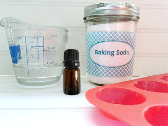 Ingredients needed for DIY Shower Bombs: Baking Soda, Water, and essential oil.