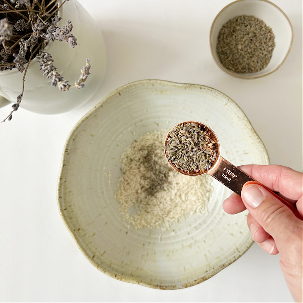 Adding dried lavender buds to a DIY sachet mix