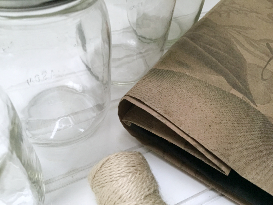 Mason Jars, twine, and a paper bag to be used for cleaning closet storage