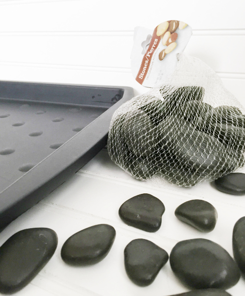 Items needed to upgrade a plastic boot tray: plastic boot tray and river rocks