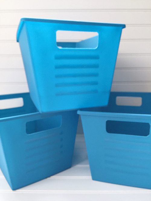 Bright blue plastic storage bins from the dollar store