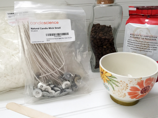 Items needed to make your own coffee candle: wax flakes, wicks, coffee mug, ground coffee, and coffee beans