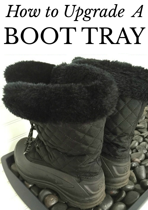 Boots sitting in boot tray filled with black river rock