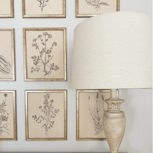 Lamp in front of gallery wall