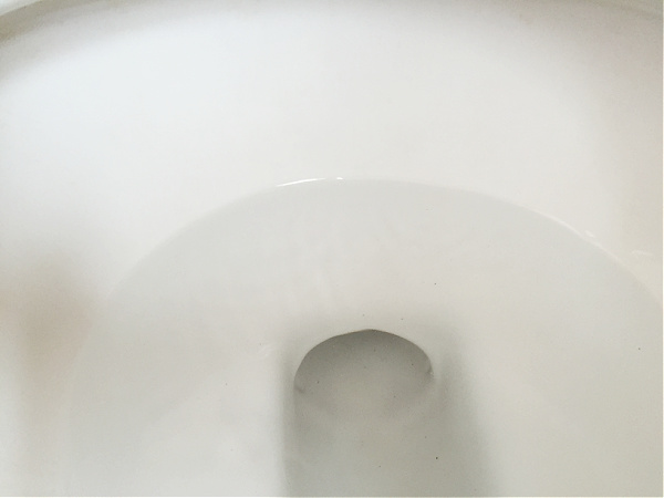 Toilet bowl after cleaning stains with pumice stone