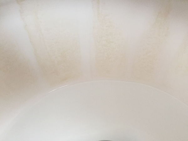 Toilet bowl with brown stains prior to cleaning