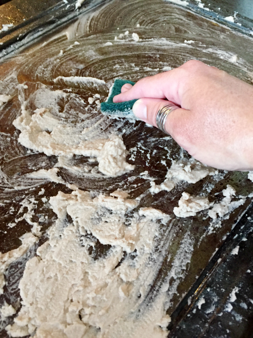 Baking soda mixed with water to clean a glass oven door