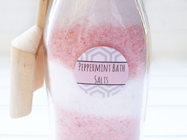 Peppermint bath salts made with Epsom salt and peppermint essential oil. Layered in pink and white.