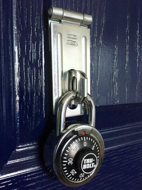 Latch and padlock display on closet door to look like a football locker bay