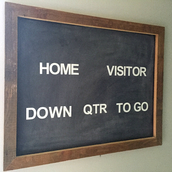 Barnwood framed scoreboard hanging in a boy's football themed bedroom