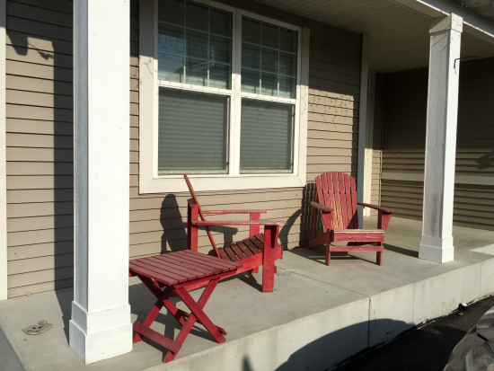 Dirty white pillars prior to porch makeover