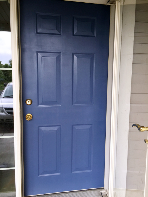 Front door painted in blue