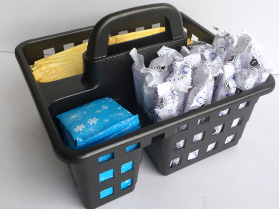 Feminine products stored in a spray painted dollar store caddy