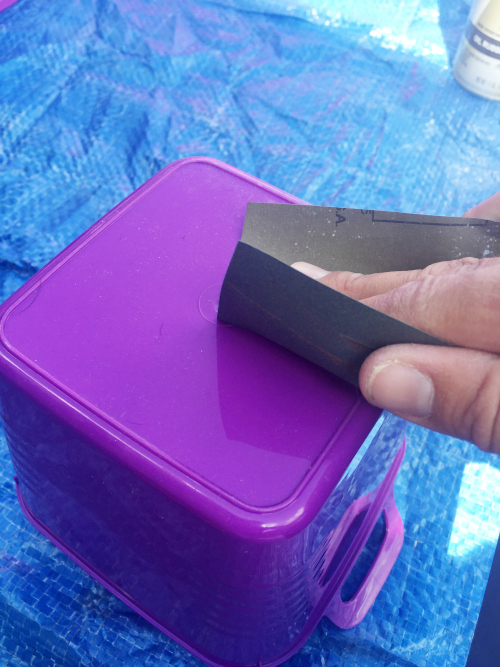 Sanding a plastic bin prior to spray painting
