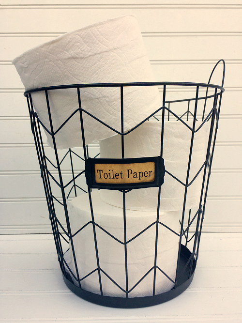 Toilet paper in spray painted wire basket