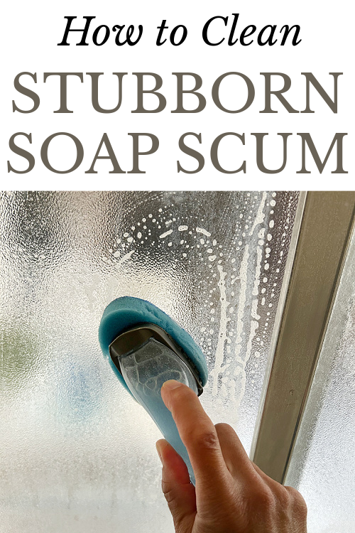 Using DIY Shower Cleaner to clean glass shower door