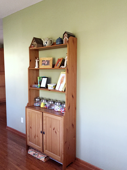 Small wooden hutch against a wall in the dining room