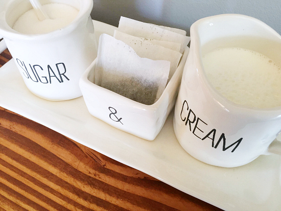 Sugar and cream set displayed on coffee station