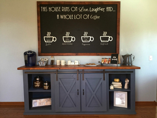 Farmhouse coffee station with a buffet displaying barn door cabinets and a large chalkboard sign