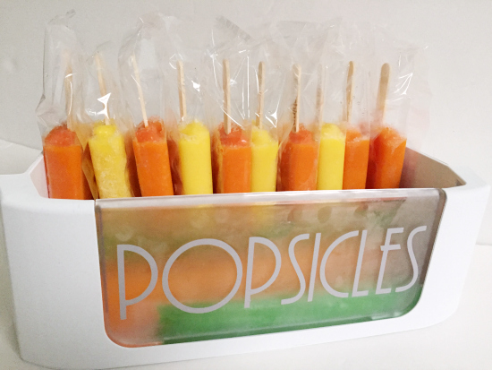Popsicles in labeled bin in freezer
