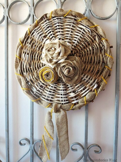 The bottom of a basket becomes free wall decor via The Boondocks Blog