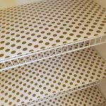 This is a perfect way to cover wire shelving using foam board and wrapping paper!