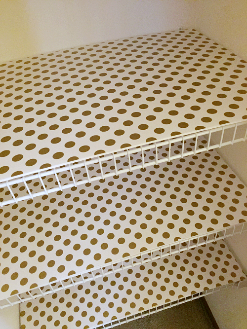 This is a perfect way to cover wire shelving using foam board and wrapping paper!