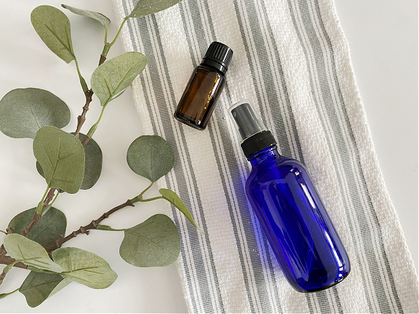 Homemade essential oil room spray using three simple ingredients: distilled water, vodka, and essential oil