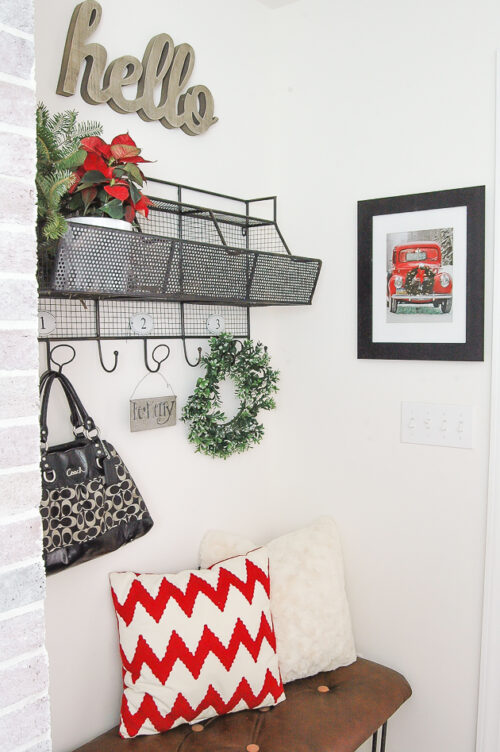 Framed gift bag becomes the perfect Christmas wall decor via Little House of Four