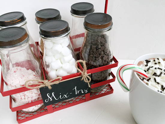 Fixings for hot cocoa bar displayed in milk jars