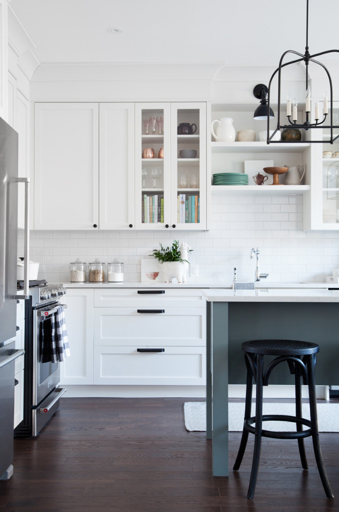 Kitchen featuring white cabinets and a dark island made over for the One Room Challenge